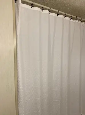 a white shower curtain in a bathroom at 1233 Apartment 3 Miami in Tamiami