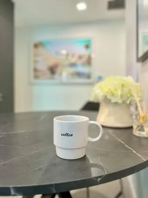 a coffee cup sitting on top of a counter at Upscale Ocean View Studio Pool and Gym in Miami