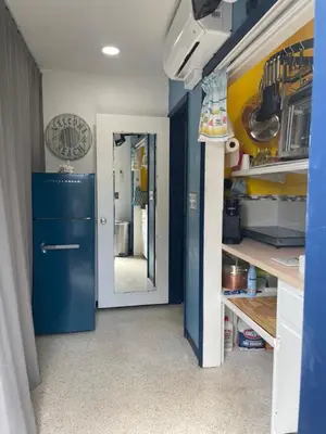 a kitchen with a blue refrigerator and a mirror at Tropical Classic Retro Florida, Private 2 bedroom Suite with Best Location in Fort Lauderdale