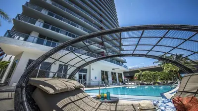 a resort with a swimming pool and a hotel at Beachwalk Resort: Amaizing View Balcony Gym Pool in Hallandale Beach