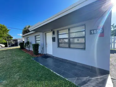 a house with the number on the side of it at Stylish Pool Home in Hollywood
