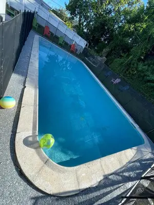 a large swimming pool with two frisbees in it at Stylish Pool Home in Hollywood