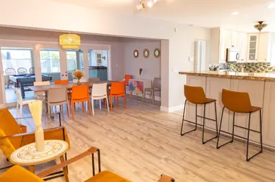 a kitchen and dining room with a table and chairs at Private Villa with Pool and Sauna in Dania Beach