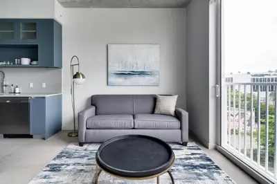 a living room with a couch and a table at Kasa Wynwood Miami in Miami