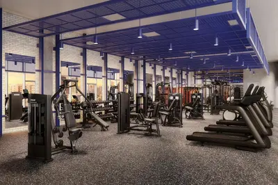 a gym with rows of treadmills and exercise machines at Kasa Wynwood Miami in Miami