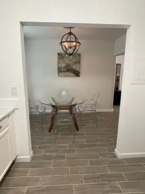 a dining room with a table and chairs at City First Story Apartments & Cottage in Fort Lauderdale