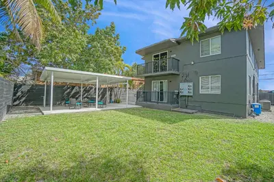 an image of a house with a large yard at Elegant Wynwood Flats in Miami
