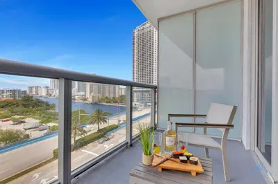 a balcony with a view of a city skyline at Prime Location Amazing Pool Balcony Bay View in Hallandale Beach