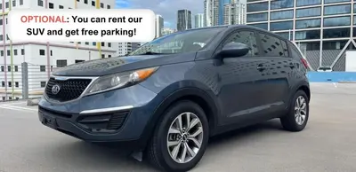 a blue car is parked in a parking lot at Spectacular Infinite View Balcony Pool Gym in Hallandale Beach