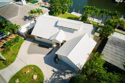 an overhead view of a house with a white roof at Marble House in Lauderdale Harbours in Fort Lauderdale