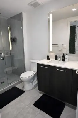 a bathroom with a toilet and a shower and a sink at Downtown Miami 2Br 2Bath Oasis Bayside & Port of Miami Minutes Away in Miami