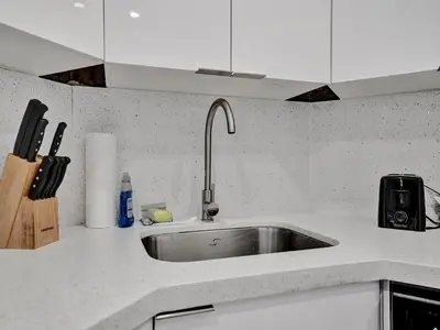 a kitchen with a sink and a counter top at Gorgeous Miami Beach Condo 1614 in Miami Beach