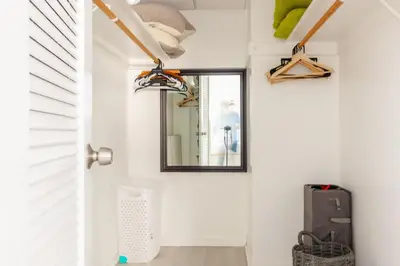 a room with a door and a mirror at Apt w/2 Queen Beds & Ocean View at Tides in Hollywood