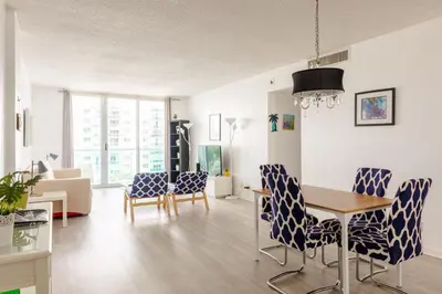 a living room with a dining room table and chairs at Apt w/2 Queen Beds & Ocean View at Tides in Hollywood