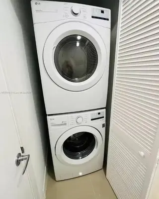 a washer and dryer in a small room at NEW 3 Story in Homestead- 3/2.5 Balcony & Rooftop in Homestead