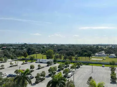 an aerial view of a parking lot with cars at Cozy apartment near Seminole Hard Rock Cafe in Hollywood
