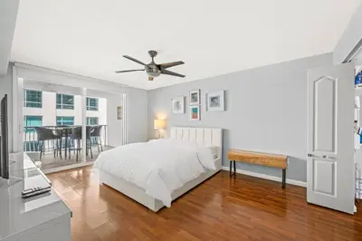 a bedroom with a bed and a ceiling fan at Luxe 1 BDR • 32th Floor • Brickell • Ocean Views in Miami