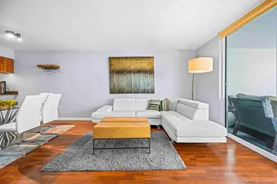 a living room with white furniture and a table at Luxe 1 BDR • 32th Floor • Brickell • Ocean Views in Miami