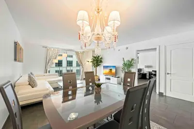 a dining room and living room with a dining table at Luxury 1 BDR • 30th Floor • Brickell • Water Views in Miami