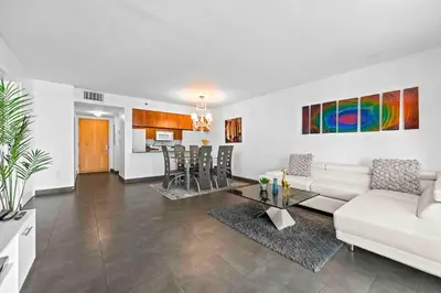 a living room with a white couch and a table at Luxury 1 BDR • 30th Floor • Brickell • Water Views in Miami