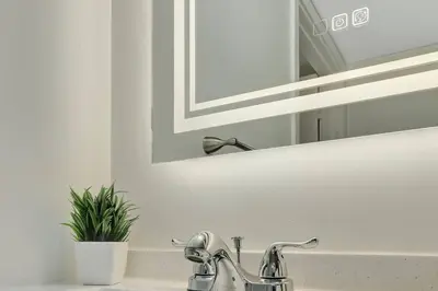 a bathroom sink with a mirror and a faucet at Lux 1B condo with XL Balcony, Pool, Gym & Games in Miami