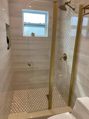 a shower with a glass door in a bathroom at Nice and Cozy guest house 4 in Miami