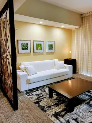 a living room with a white couch and a coffee table at Doral Pool 1107 by Wave Properties in Miami