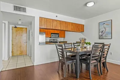 a kitchen and dining room with a table and chairs at Comfy 28th floor • Brickell • Ocean & City Views in Miami