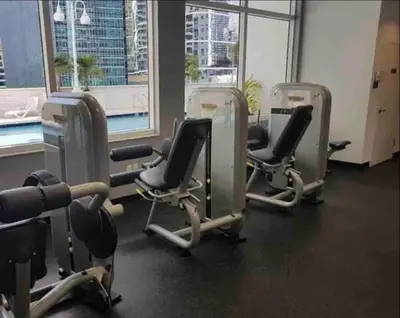 a gym with three rows of exercise bikes in front of a window at Stunning 1 BDR 1 BTH • Brickell • Bay & City Views in Miami