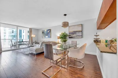 a living room with a table and chairs and a couch at Beautiful 1 BED 1 BTH • Brickell in Miami