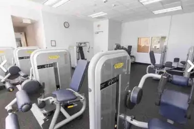 a gym with rows of exercise bikes and machines at Exquisite 1 Bed • 33 Floor •Brickell • Ocean Views in Miami