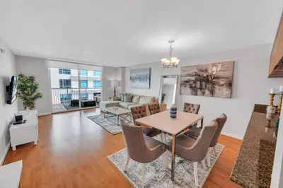 a dining room and living room with a table and chairs at 35th floor 1 BED 1 BTH • Brickell • Ocean View in Miami