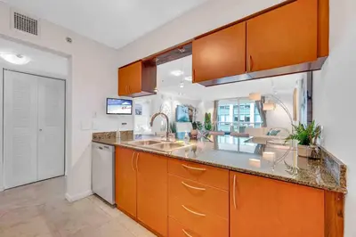 a kitchen with a sink and a counter top at PH 41st Floor 3 BED • Brickell • Ocean View in Miami
