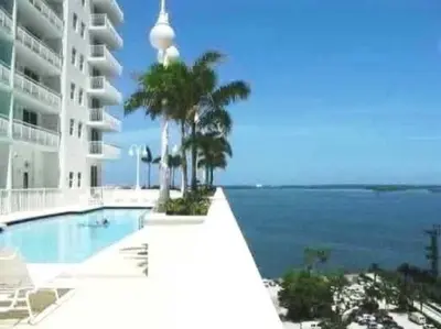 a swimming pool with a view of the ocean at PH 41st Floor 3 BED • Brickell • Ocean View in Miami