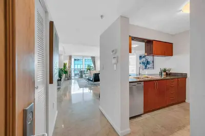 a kitchen with white walls and an open floor plan at PH 41st Floor 3 BED • Brickell • Ocean View in Miami