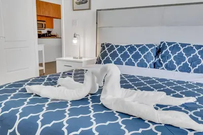 a blue and white bed with two pillows on it at Dazzling 1 BED 1 BTH • Brickell • Bay & City View in Miami