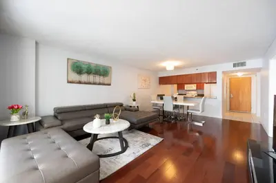 a living room with a couch and a table at Splendid 1 Bed Apartment • Brickell • Water Views in Miami