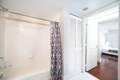 a bathroom with a shower and a bath tub at Splendid 1 Bed Apartment • Brickell • Water Views in Miami