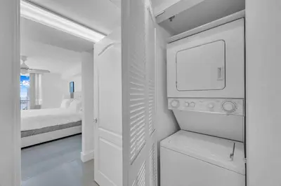 a white bedroom with a bed and a white door at Luxe 1 BDR •Brickell• Ocean View in Miami