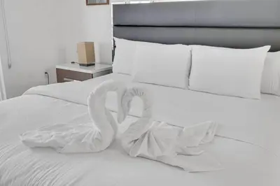 two swans made out of towels on a bed at Ocean view 1BR Condo Brickell-FreeParking in Miami