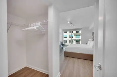 a white bedroom with a bed and a window at Spacious 36th FLR 1 BD 1 BT • Brickell • Bay View in Miami