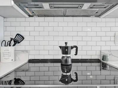 a coffee pot on a counter in a kitchen at Contemporary 2BR Home with Pool & BBQ Access in Fort Lauderdale