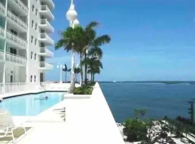 a swimming pool with a view of the ocean at Beautiful 1 Bed 1 Bath • Brickell • Bay View in Miami