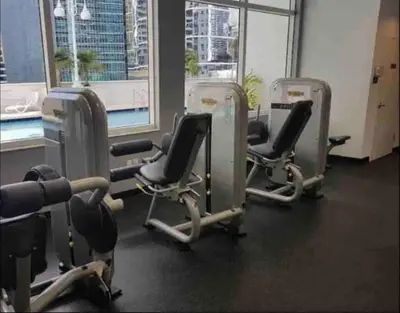 a gym with three rows of chairs and a pool at Beautiful 1 Bed 1 Bath • Brickell • Bay View in Miami