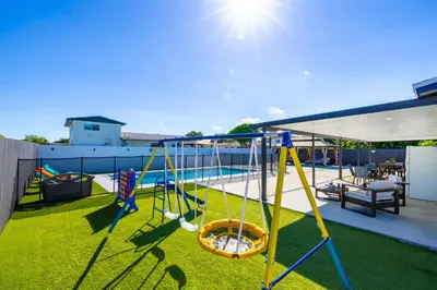 a playground on the roof of a house at Havana Blue/Pool+Heater/Hard Rock/Gazebo/BBQ in Miami
