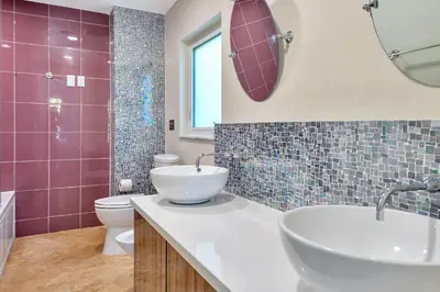 a bathroom with a sink and a tub and a toilet at Luxury Villa 5BR and 3BR in Hollywood Lakes near Beach in Hollywood