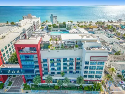an aerial view of a building next to the ocean at Studio - Steps from Hollywood Boardwalk in Hollywood