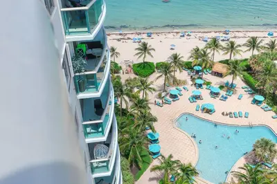 an aerial view of a resort with a pool and a beach at PROMO Komffy Penthouse w King Bed and Ocean view at Tides 16th floor in Hollywood