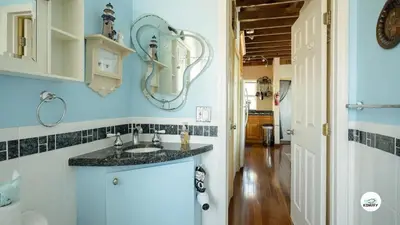 a bathroom with a sink and a mirror on the wall at Komffy Studio Waterfront w/King Bed & Free Parking in Hollywood