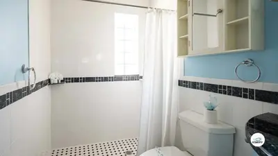 a bathroom with a white toilet and a shower at Komffy Studio Waterfront w/King Bed & Free Parking in Hollywood